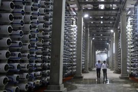 People-walk-in-a-desalination-plant-before-during-its-inauguration-in-Hadera